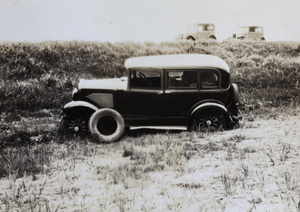 Three cars, one having left the road (tyre removed)