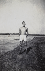 Shanghai Rowing Club member standing on a river embankment