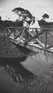 Jack Ephgrave and another man on a wooden bridge near Shanghai Rowing Club