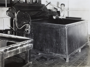 Worker with commercial printing equipment, Pudong, Shanghai