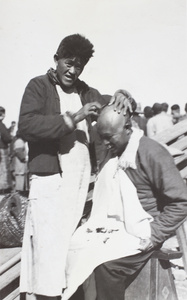 Street barber and customer