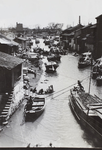 Barges and boats on a busy waterway