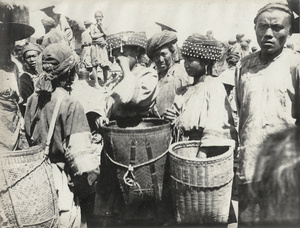 Young Tame Ma women in the market at Ta Ya K'ou, Yunnan