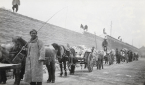 Demolishing the wall of the Imperial City and carting away the bricks, Beijing