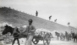 Demolishing the wall of the Imperial City and carting away the bricks, Beijing