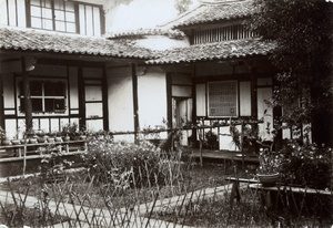 A garden, with an unusual plant holder across it