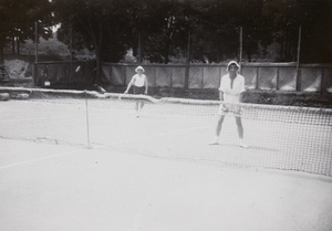 F. Hagger and another man playing tennis, Weihai (威海)