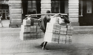 A porter carrying a heavy load