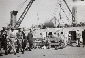 Royal Navy sailors on the fore well deck of H.M.S. Medway