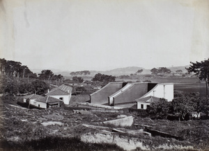 View, over a Chinese cemetery, of the fives courts and bowling alley, Fuzhou, 1869