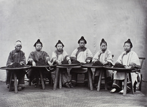 Women posed sorting or culling tea, near Xingcun, Fujian