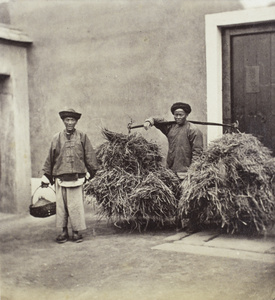 Two men: one carrying a basket, one carrying straw, Xiamen