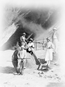 A walking party, including Fu Bingchang, beside balancing rocks