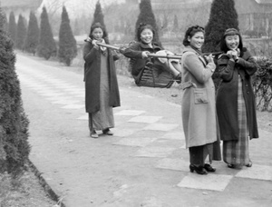 Min Chin, Jiang Fangling and Ma Xiuzhong carrying Liu Shengyi