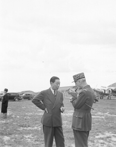 Hu Shize with a French official at an airfield in Moscow, during T.V. Soong's visit