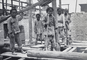Child labourers working on a building site