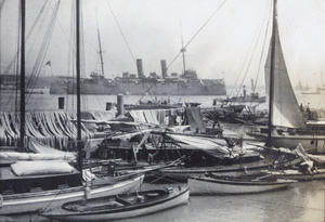 A battleship and other boats on the Huangpu River, Shanghai