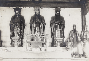 Temple shrine with figures and incense burner