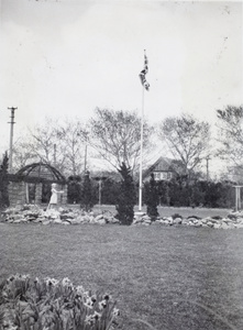 Sculpture and flagpole in the garden at 727 Avenue Haig, Shanghai