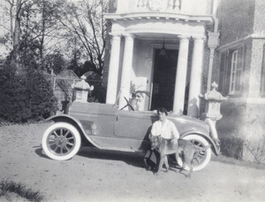 Myrtle Johnson sitting on the running board of a car, and Rex, 727 Avenue Haig, Shanghai