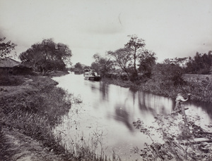 A houseboat in a creek, Feng wen shan, near Shanghai