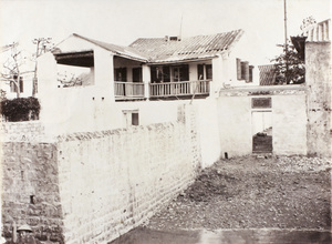 Hedgeland on the veranda of the Hoihow Assistant's house