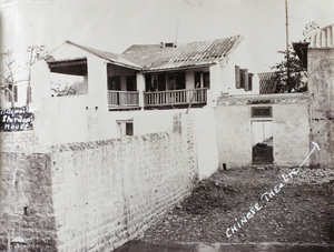 Hedgeland on the veranda of the Assistants' quarters, Hoihow