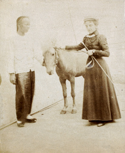 Mrs Lowry with servant and pony at Hoihow