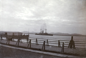 A gunboat on the Yangtze River and a hulk at Butterfield and Swire’s Bund, Nanjing (南京市)
