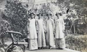 Four women in Chinese dresses, Hong Kong