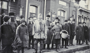 Passengers waiting on a station platform in 1913