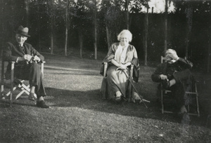 Hedgeland and others sitting outdoors