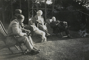 Hedgeland and others sitting outdoors