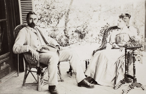 Guy and Ada Hillier taking tea on a veranda, Beijing