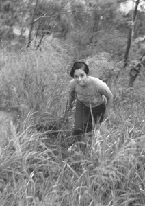 Elsie Markham in a wooded area above a Castle Peak Road beach, Hong Kong
