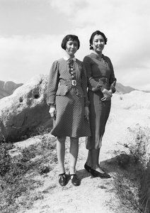 Gladys Hutchinson and an unidentified woman modelling a polka-dot patterned dresses, Hong Kong