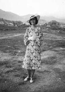 Bea Hutchinson modelling a paisley print dress, near the Army Sports Ground, Mongkok, Hong Kong