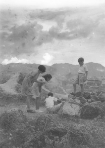 Gladys and Jim Hutchinson, Patricia Thoresen and Olav Kulstad, playing near the Army Sports Ground, Mongkok, Hong Kong