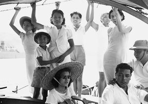 Friends and family members on a ferry boat, Hong Kong