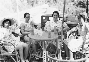 Gladys and Bea Hutchinson on a day trip with Elise Markham and Lilian Thoresen, sitting at a cafe table with refreshments, Hong Kong