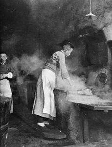 Two workers in a hot water shop (old tiger stove shop or laohuzao), Shanghai