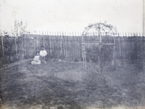 Two children in the garden of 35 Tongshan Road house, Hongkew, Shanghai