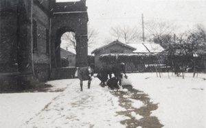 Four people making snowballs in the garden of 35 Tongshan Road, Hongkou, Shanghai