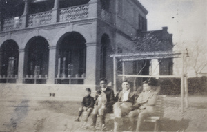 Fred, Bill, Charles and Tom Hutchinson on a bench in the Tongshan Road garden, Hongkew, Shanghai