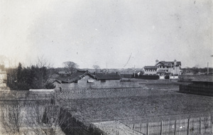 Gardener working in the fields behind the Hutchinson family house, Hongkew, Shanghai