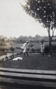 Harry, Dick and Fred Hutchinson playing with hammock in the garden of 35 Tongshan Road, Hongkou, Shanghai
