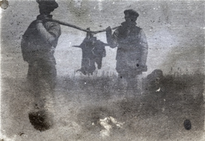 Men carrying shot wild game on a yoke, near Shanghai