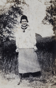 Hannah at the edge of a field