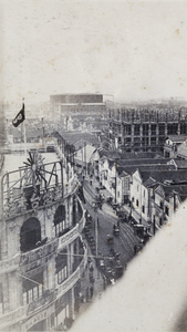 View overlooking a street junction towards a building under construction and gas works, Shanghai