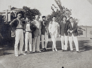 Tom and Bill Hutchinson, John Henderson and four other men standing in the garden, 35 Tongshan Road, Hongkou, Shanghai